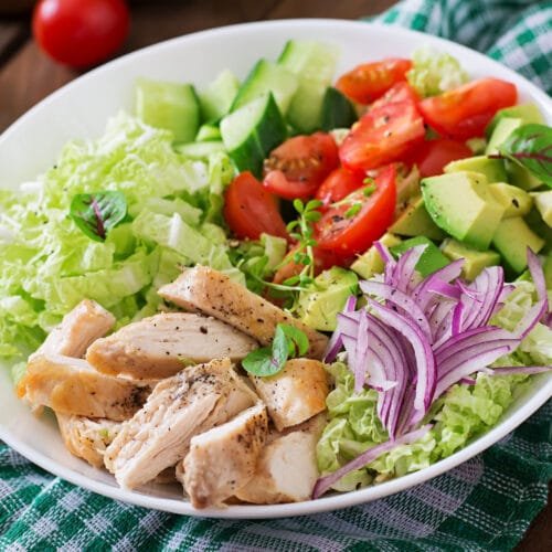 Dietary salad with chicken, avocado, cucumber, tomato and Chinese cabbage